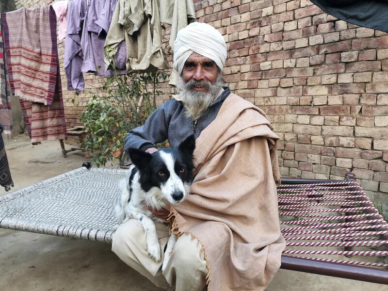 Balbir Singh seen with his dog Jacky. The 65-year-old farmers has returned to his village Rauni after protesting for nearly 50 days at Singhu border just outside capital New Delhi against the farm laws. Taniya Dutta for The National