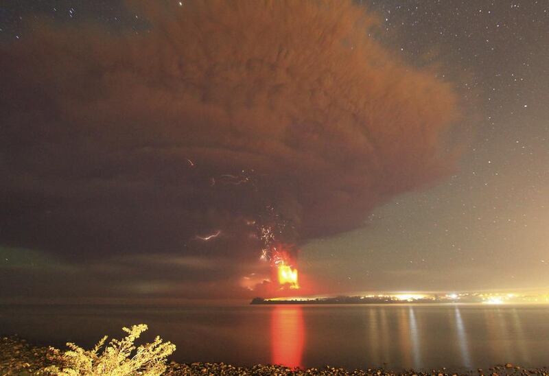 Smoke and lava spew from the Calbuco volcano, as seen from the shores of Lake Llanquihue in Puerto Varas. Carlos Gutierrez / Reuters