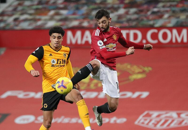 Manchester United's Bruno Fernandes in action with Wolves' Ki-Jana Hoever. Reuters
