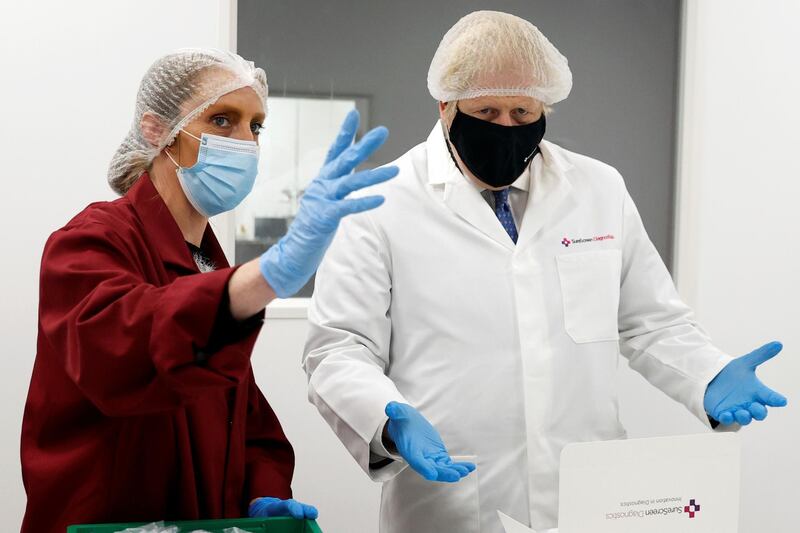 Boris Johnson speaks with an employee at SureScreen Diagnostics. Reuters