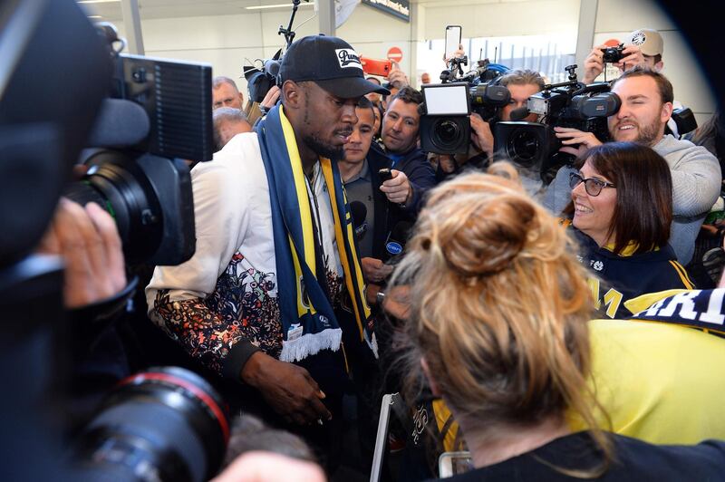 Usain Bolt talks to the media  at Sydney international airport. AFP