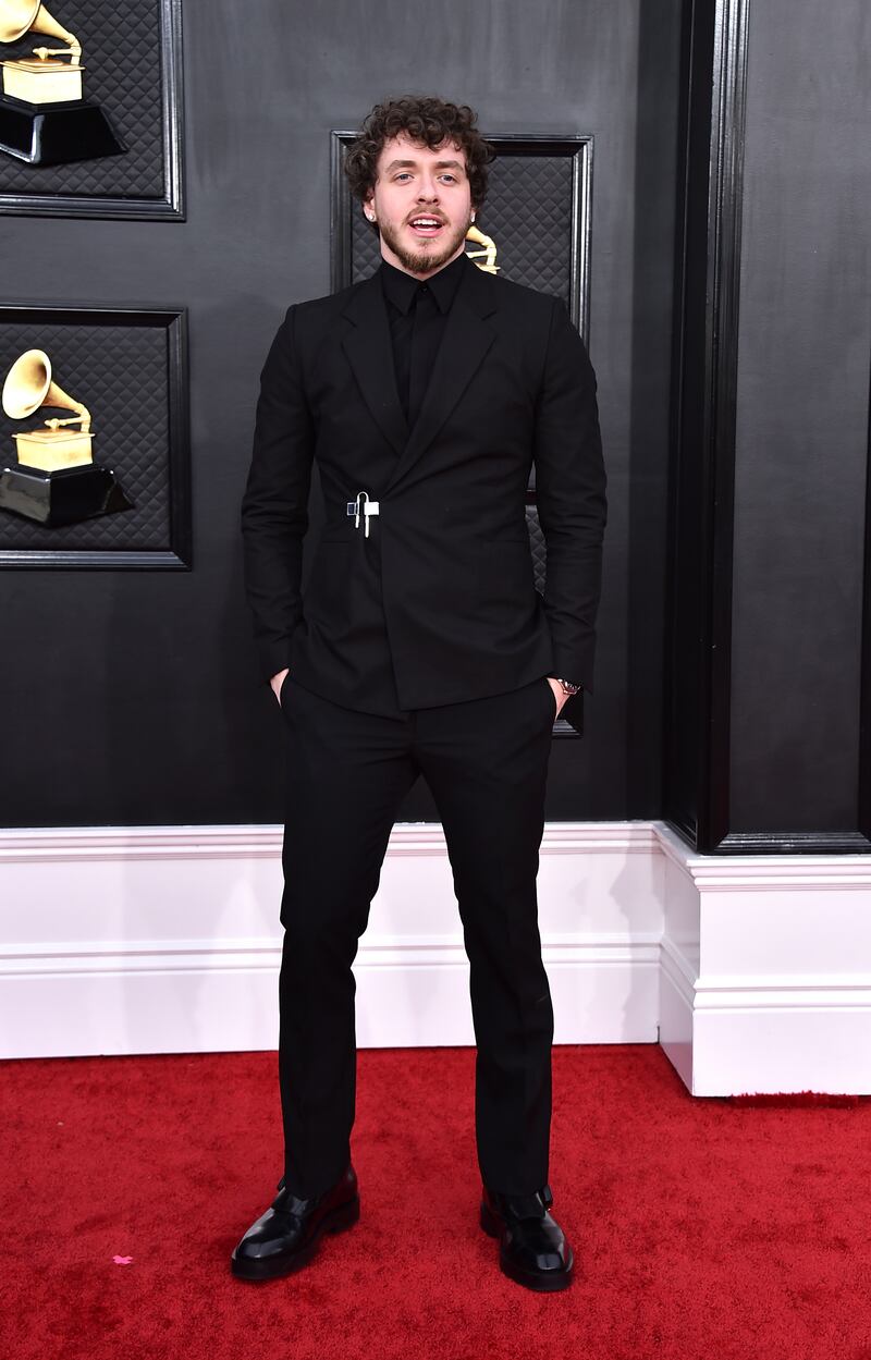 Jack Harlow, wearing a black Givenchy suit. AP