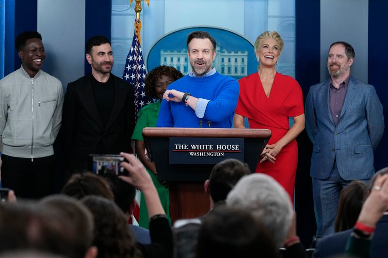 Jason Sudeikis (C), who plays the title character in TV series Ted Lasso, speaks at the White House in Washington. AP