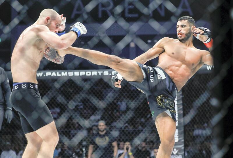 Abu Dhabi, United Arab Emirates, October 18, 2019.  UAE Warriors Fighting Championship at the Mubadala Arena.--  Mounir Lazzez of Tunisia kicks Sasha Palatnikov at the welterweight division fight.
Victor Besa/The National
Section:  SP
Reporter:  Amith Passela