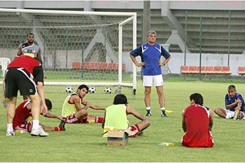 Ione Andone, in blue, oversees an Al Ahli training session. The Romanian has yet to see his work during pre-season manifest itself on the pitch and will be hoping things fall into place in the Super Cup tonight.