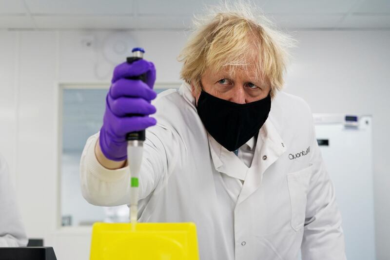 Britain's Prime Minister Boris Johnson visits the QuantuMDx Biotechnology company, which has developed a 30-minute PCR diagnostics device, in Newcastle, Britain. Reuters