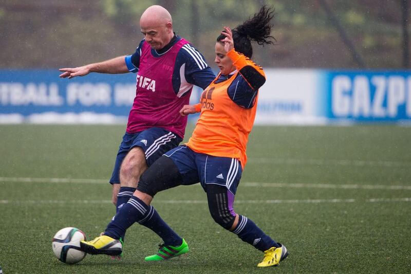 New Fifa president Gianni Infantino (L) fights for the ball during a Fifa Team Friendly Football Match at the Fifa headquarters on February 29, 2016 in Zurich, Switzerland. (Photo by Philipp Schmidli/Getty Images)