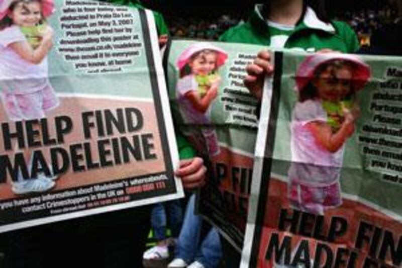 Celtic Football Club fans hold posters of Madeleine McCann inside Celtic Park in Glasgow, Scotland, eight days after her disappearance.