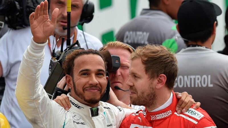 Lewis Hamilton, left, secured a fifth F1 title with a fourth-placed finish at the Mexican Grand Prix. Reuters