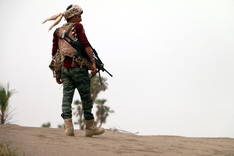 epa06847532 A member of Yemeni government forces backed by the Saudi-led coalition takes position during an attack on the port city of Hodeidah, on the outskirts of Hodeidah, Yemen, 27 June 2018 (Issued 28 June 2018). According to reports, Yemeni government forces backed by the Saudi-led coalition have made major gains south of Hodeidah during a military offensive to regain control of the Red Sea port-city that acts as an entrance point for Houthi rebel supplies and humanitarian aid.  EPA/NAJEEB ALMAHBOOBI