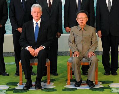 FILE - In this Aug. 4, 2009, file photo released by Korean Central News Agency via Korea News Service in Tokyo, former U.S. President Bill Clinton, seated left, meets with North Korean leader Kim Jong Il, seated right, in Pyongyang, North Korea. U.S. President Donald Trump could become the first sitting U.S. president to visit North Korea if plans for a summit with Kim Jong Un hold. But other prominent American political figures have visited Pyongyang in the past, many with a similar goal of trying to stop its nuclear program. On August 4, 2009, former President Bill Clinton arrived unannounced in North Korea on a mission to free two detained American journalists, Laura Ling and Euna Lee.  (Korean Central News Agency/Korea News Service via AP, File)