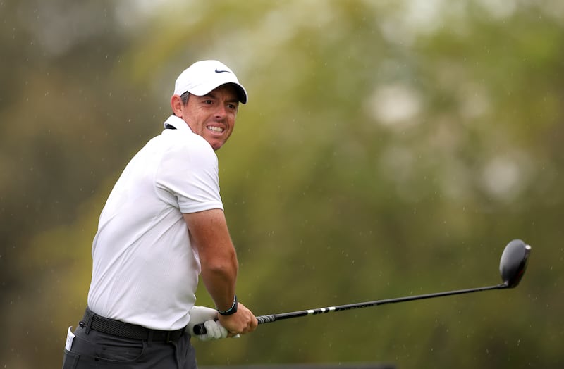 McIlroy tees off on the 3rd hole. Getty