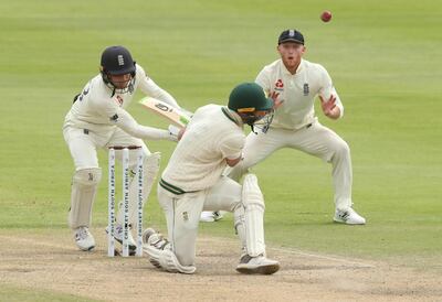 Cricket - South Africa v England - Second Test - PPC Newlands, Cape Town, South Africa - January 6, 2020   South Africa's Pieter Malan in action as England's Ben Stokes reacts   REUTERS/Mike Hutchings