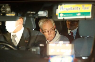 Greg Kelly, the former deputy of ousted Nissan chairman Carlos Ghosn, is seen in the car, as he leaves after being released from a detention centre in Tokyo, Japan, December 25, 2018. REUTERS/Kim Kyung-Hoon