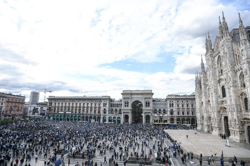 Internazionale supporters celebrate at Piazza Duomo in Milan after their team won the Serie A title. AFP
