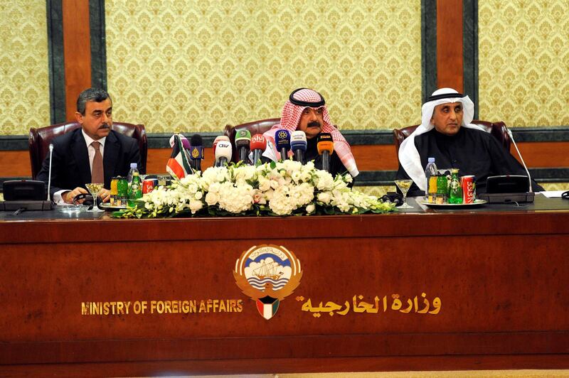 Kuwaiti deputy foreign minister Khaled Al Jarallah and secretary general of Iraq’s council of minister Mehdi Al Alaq.Handout photos from KUNA