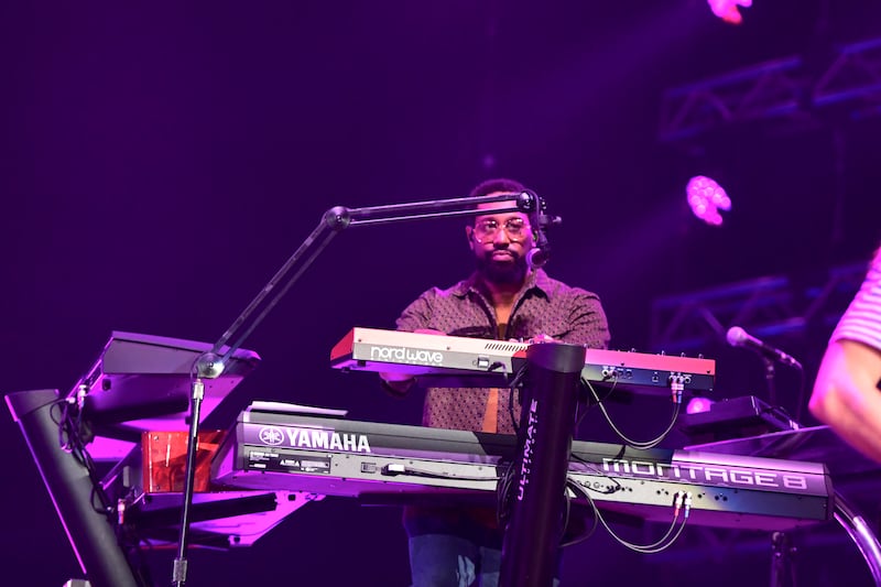 PJ Morton, keyboardist of Maroon 5, performs on stage.