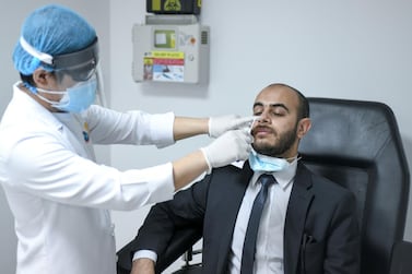 Abu Dhabi, United Arab Emirates - Medical staff testing patients for Covid-19 at Advanced Centre for Daycare Surgery. Khushnum Bhandari for The National