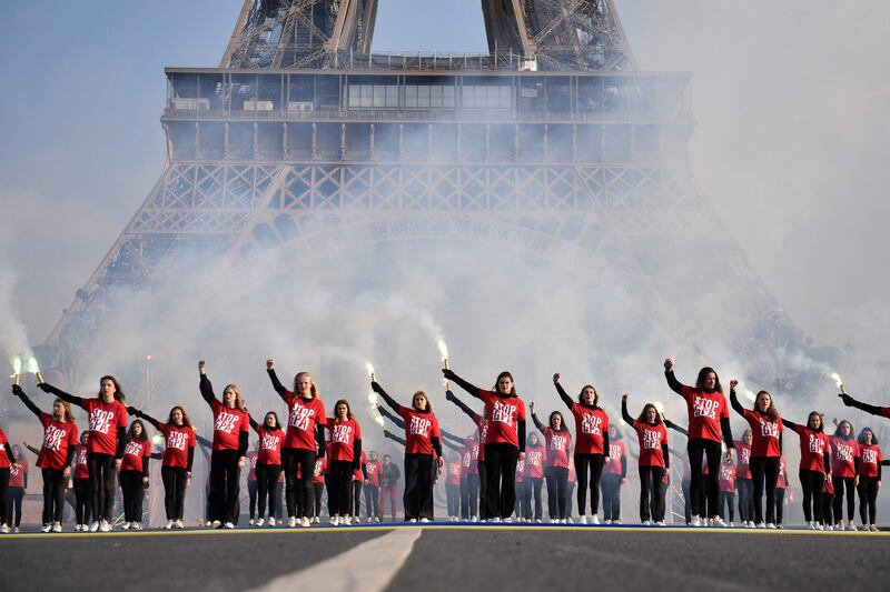 Members of the conservative activist group Manif pour Tous, or "Protest for Everyone", stage a demonstration against surrogacy near the Eiffel Tower in Paris.  AFP