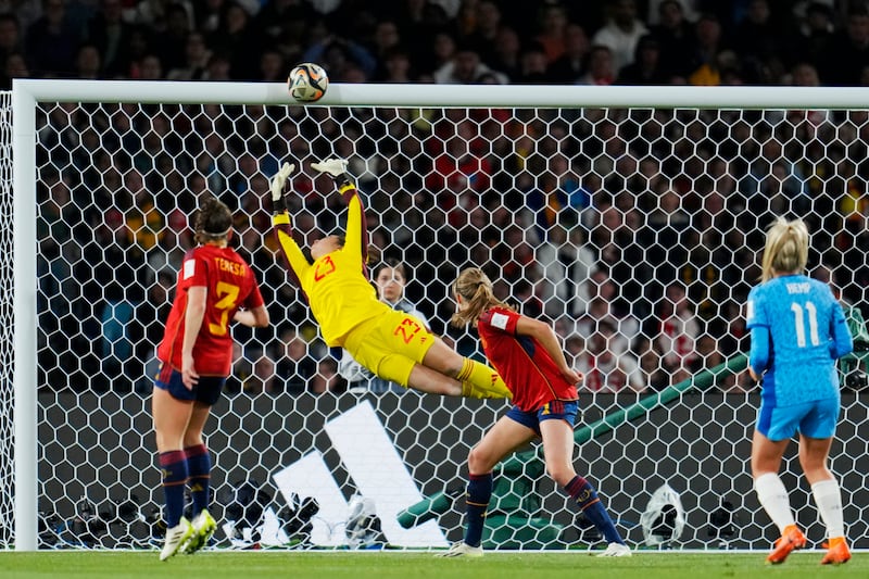 A shot from England's Lauren Hemp, right, hits the crossbar . AP