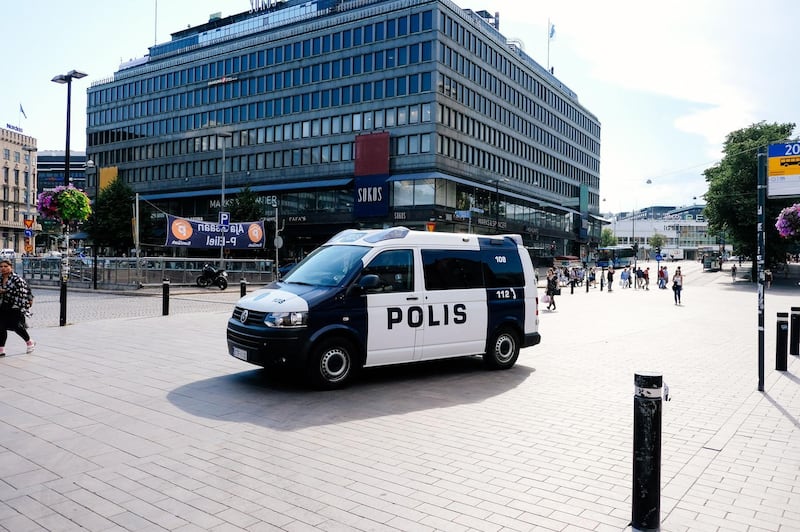 A police van patrols a street near the train station in Helsinki, Finland on July 14, 2018, ahead of the meeting between US President Donald Trump and his Russian counterpart Vladimir Putin.  Finland may have largely shut down for the summer holidays but officials and police have been drafted back into work ahead of a historic summit in Helsinki between Donald Trump and Vladimir Putin.

 / AFP / Alessandro Rampazzo

