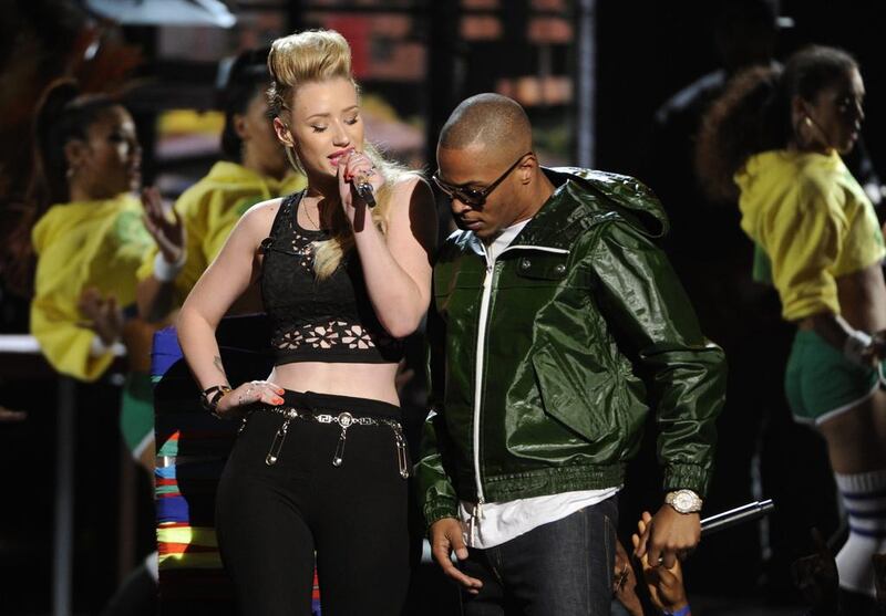 Iggy Azalea, left, and TI perform at the BET Awards. Chris Pizzello / Invision / AP
