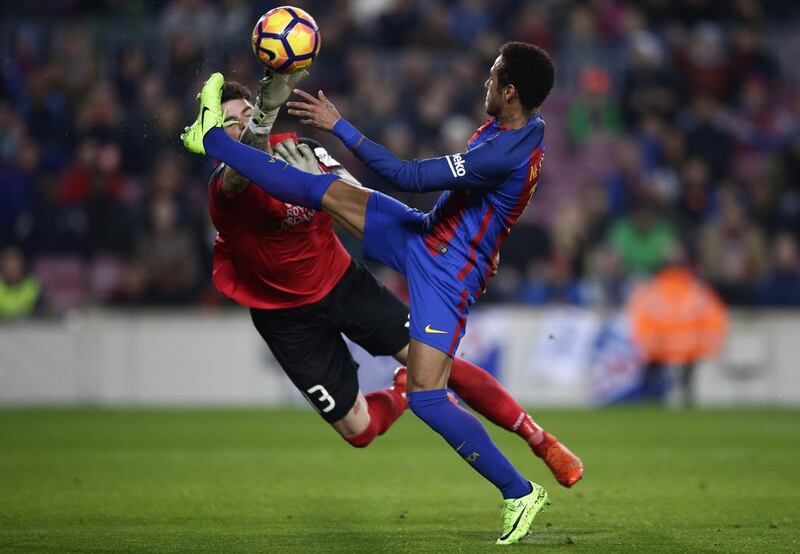 Barcelona’s Neymar, right, duels for the ball against Leganes’ Iago Herrerin. Manu Fernandez / AP Photo