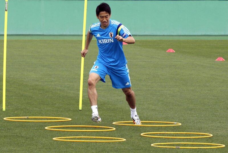 Shinji Kagawa works out during a training session with Japan ahead of the 2014 World Cup on May 19, 2014. Shuji Kajiyama / AP