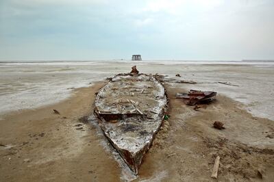 The wreckage of a boat is seen stuck in solidified salts and sands at Lake Urmia, in a photo taken on February 16, 2014.  AP 