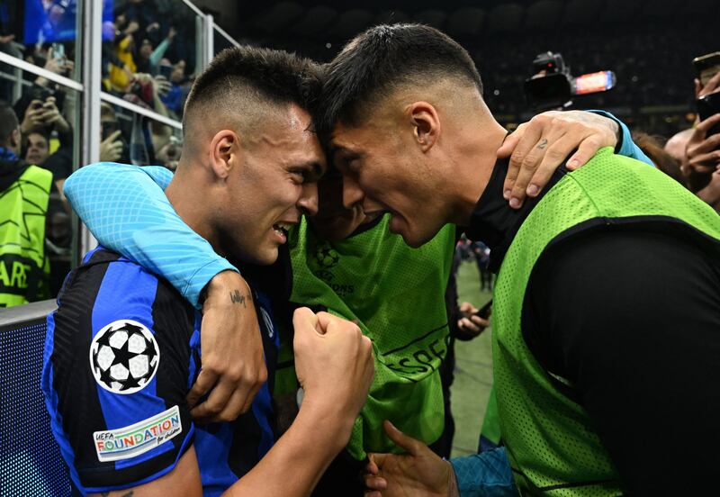 Inter Milan's Lautaro Martinez celebrates scoring their first goal with Joaquin Correa. Reuters