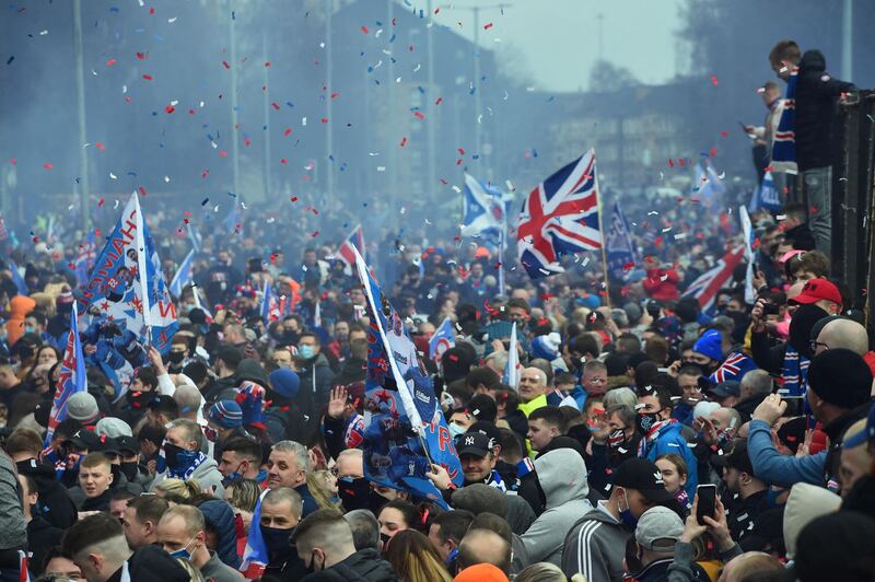 Rangers fans celebrate outside Ibrox Stadium, home of Rangers Football Club, in Glasgow, Scotland, after their first Scottish Premiership title for 10 years was confirmed. AFP
