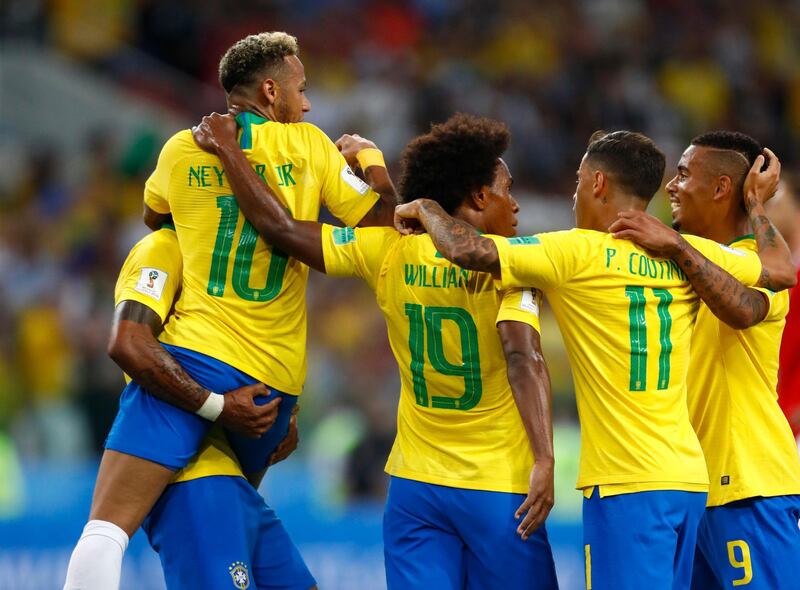 Brazil players celebrates after their teammate Brazil's Paulinho, left, scores his side's first goal during the group E match between Serbia and Brazil, at the 2018 soccer World Cup in the Spartak Stadium in Moscow, Russia, Wednesday, June 27, 2018. (AP Photo/Matthias Schrader)