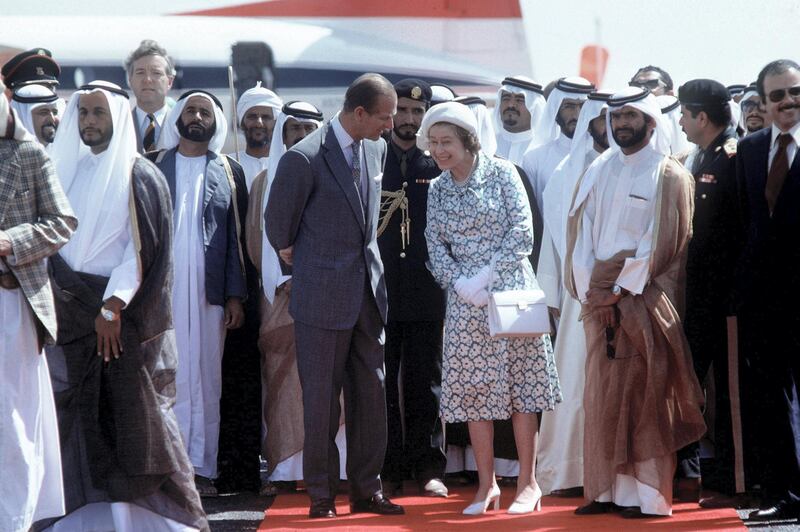 ABU DHABI, UNITED ARAB EMIRATES - FEBRUARY 25:  The Queen And Prince Philip Laughing Together On A Visit To Abu Dhabi On Their Tour Of The Gulf States.they Were Watching The Ruler Hh Sheikh Zayed Bin Sultan Al Nayan Dance Towards Them In A Dance Of Welcome.  (day Date Not Certain. Gulf Tour Dates 12 Feb - 1 March 1979)  (Photo by Tim Graham Photo Library via Getty Images)