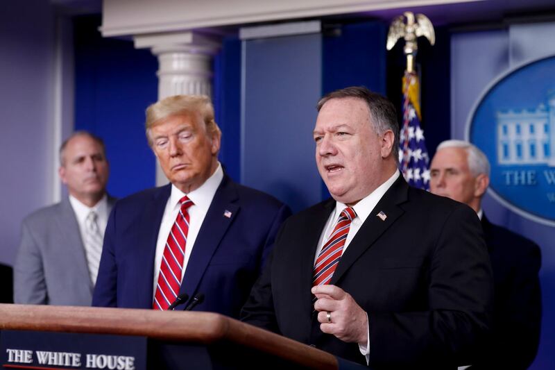 epa08310008 US secretary of state Mike Pompeo (R) speaks as U.S. President Donald Trump (2-L) listens during a Coronavirus Task Force news conference in the briefing room of the White House in Washington, D.C., USA, 20 March 2020. Americans will have to practice social distancing for at least several more weeks to mitigate U.S. cases of Covid-19, Anthony S. Fauci of the National Institutes of Health said today. Countries around the world are taking increased measures to stem the widespread of the SARS-CoV-2 coronavirus which causes the Covid-19 disease.  EPA/AL DRAGO / POOL