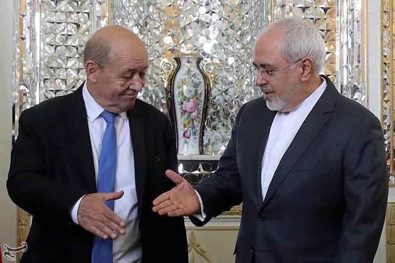 Iranian Foreign Minister Mohammad Javad Zarif reaches out to shake hands with French Foreign Affairs Minister Jean-Yves Le Drian in Tehran, Iran, March 5, 2018. Tasnim News Agency/Handout via REUTERS ATTENTION EDITORS - THIS PICTURE WAS PROVIDED BY A THIRD PARTY. NO RESALES. NO ARCHIVE.