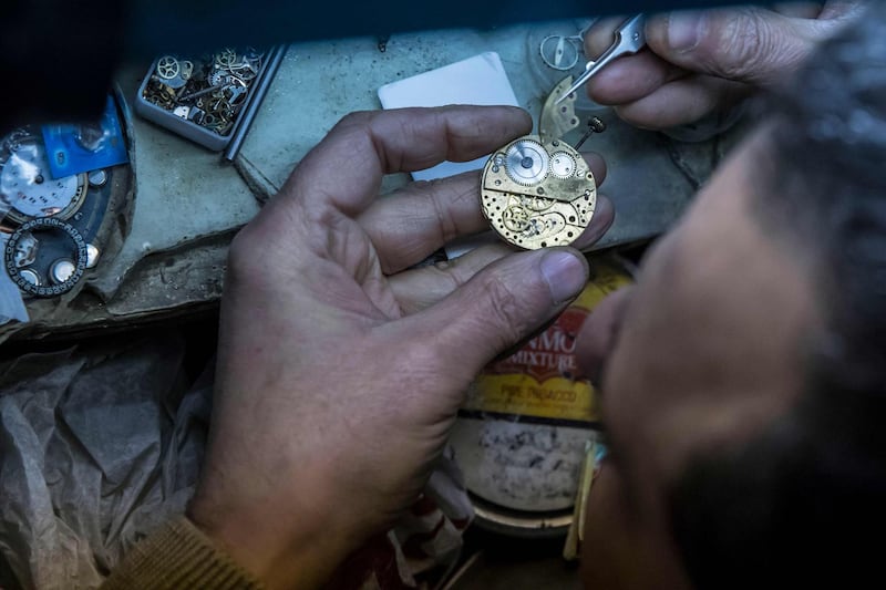 Refaat Makary, a 58-year-old Egyptian watchmaker, repairs a watch at Francis Papazian. The Armenian watchmaker shop has been a feature of Cairo since in 1903. AFP