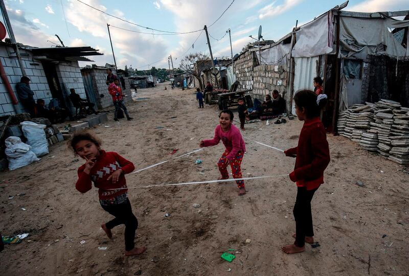 Palestinian children play at a refugee camp in Khan Yunis in the southern Gaza Strip.  AFP