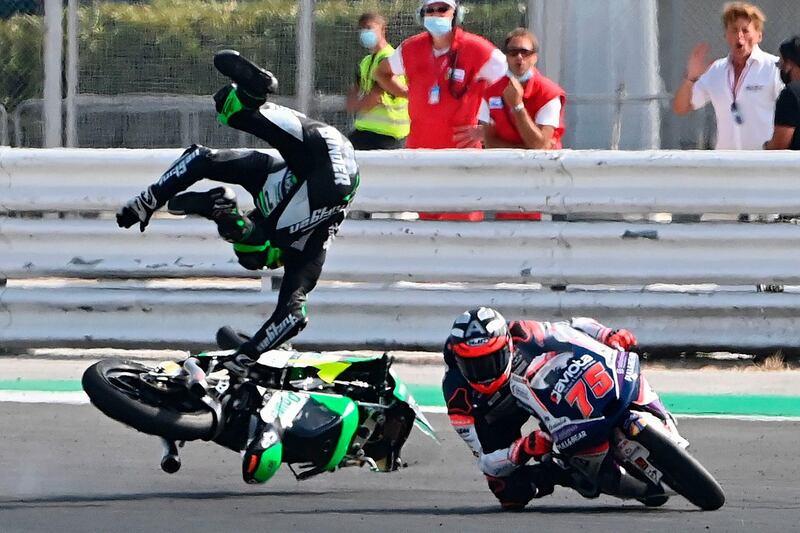 CIP Green Power's South African rider Darryn Binder flies off his bike after he crashed during the Moto3 race of the Emilia Romagna Grand Prix at the Misano World Circuit Marco Simoncelli. AFP
