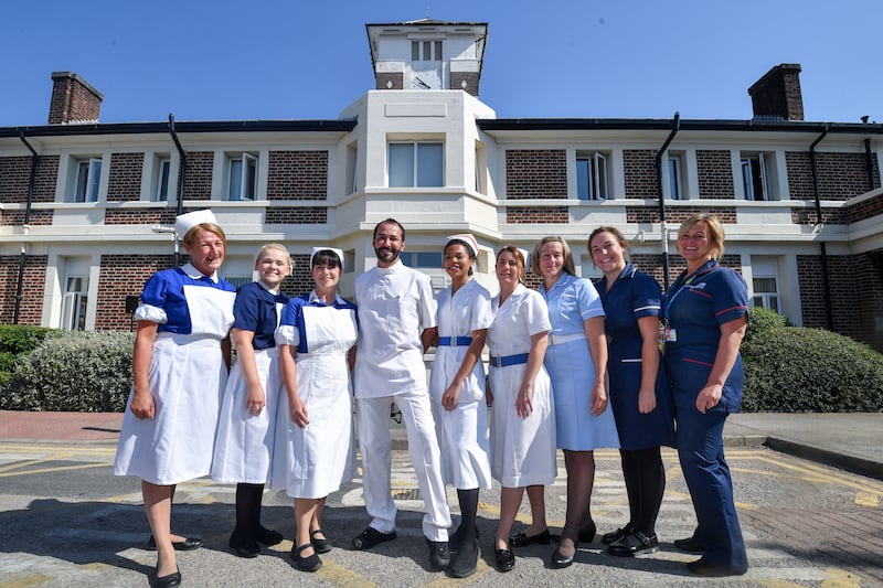 Nurses in uniforms from each decade of the NHS celebrate the 70th birthday of the NHS in 2018. Getty Images