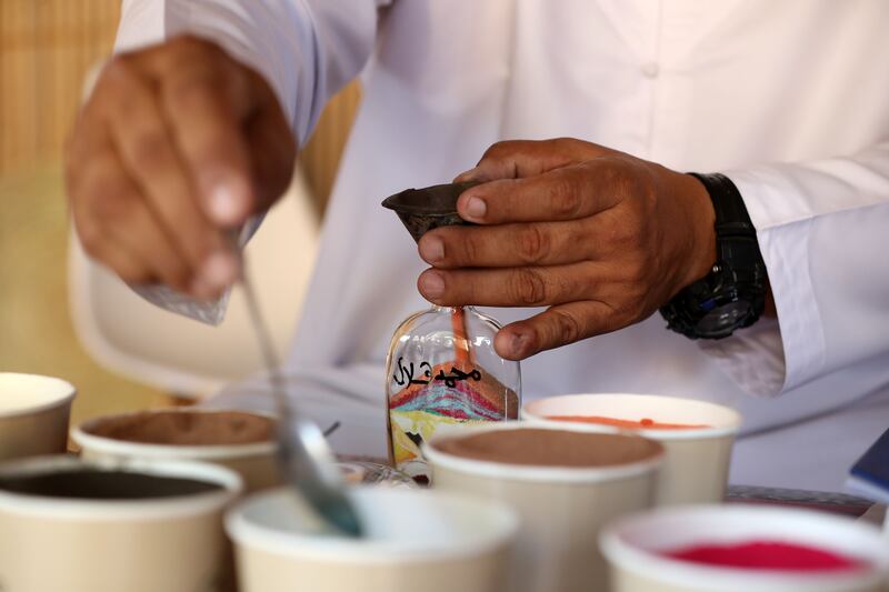 Sand artist Yasser at work during the Saturday Market