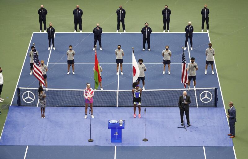 Naomi Osaka, front middle right, alongside Victoria Azarenka during the trophy presentation after beating the Belarusian in the final of the US Open at Flushing Meadows in New York, on Saturday, September 13. EPA