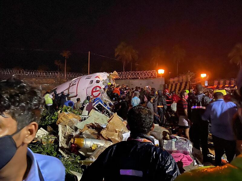 Officials inspect the wreckage site of a plane crash. EPA/Civil Defence