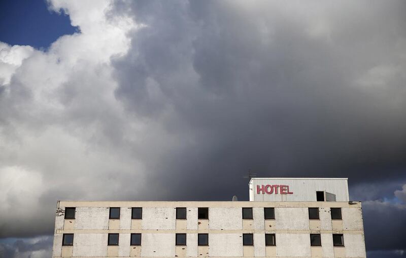 Demolition work takes place on the Howard Park Hotel in Kilmarnock. Suzanne Plunkett / Reuters