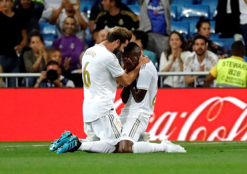 Real Madrid forward Vinicius Junior celebrates with teammate Nacho Fernandez after scoring. EPA