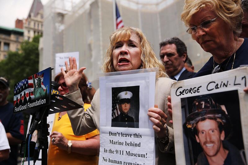 (FILES) In this file photo taken on May 26, 2014, Sally Regenhard, who lost her son on 9/11, speaks at a news conference with other family members on the steps of City Hall to criticize the placement of unidentified human remains beneath the newly opened National September 11 Memorial and Museum in New York City. - Seventeen years later, more than 1,100 victims of the hijacked plane attacks on the World Trade Center have yet to be identified. But in a New York lab, a team is still avidly working to identify the remains, with technological progress on its side. Day in, day out, they repeat the same protocol dozens of times. (Photo by SPENCER PLATT / GETTY IMAGES NORTH AMERICA / AFP)