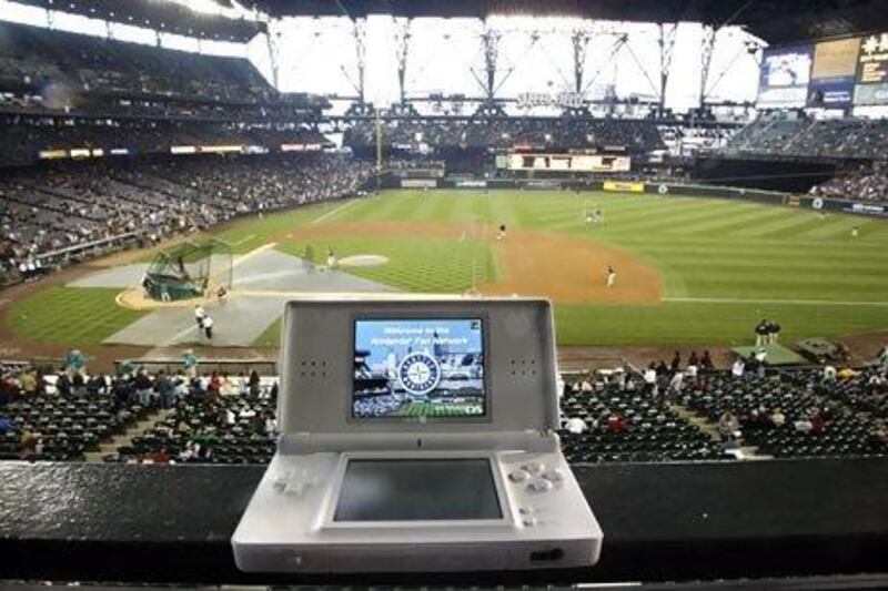 Our columnist says Seattle Mariners fans are just as comfortable buying tickets from Hiroshi Yamauchi as they games from his firm. John Froschauer / AP Photo
