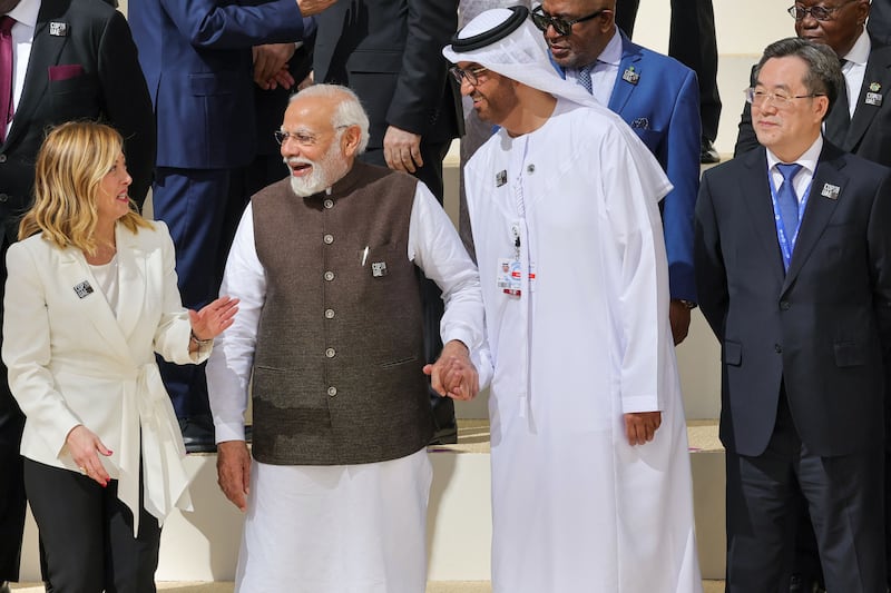 From left, Italy's Prime Minister Giorgia Meloni, Prime Minister Narendra Modi of India, Cop28 President Dr Sultan Al Jaber and Japan's Prime Minister Fumio Kishida arrive for a group photo. AFP