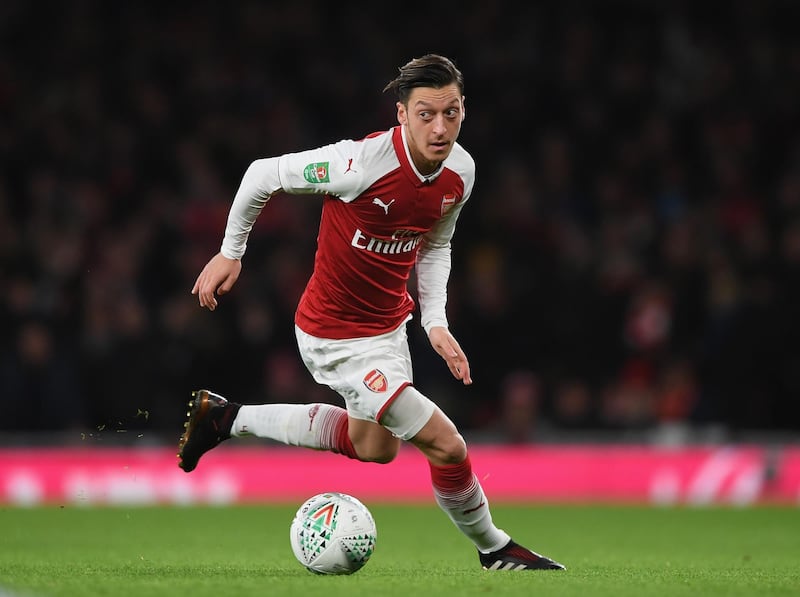 LONDON, ENGLAND - JANUARY 24:  Mesut Ozil of Arsenal runs with the ball during Carabao Cup Semi-Final Second Leg match between Arsenal and Chelsea the  at Emirates Stadium on January 24, 2018 in London, England.  (Photo by Shaun Botterill/Getty Images)