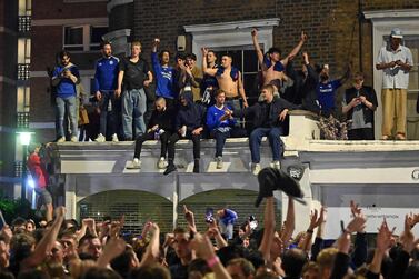 Chelsea supporters celebrate in streets surrounding Chelsea's Stamford Bridge stadium. AFP