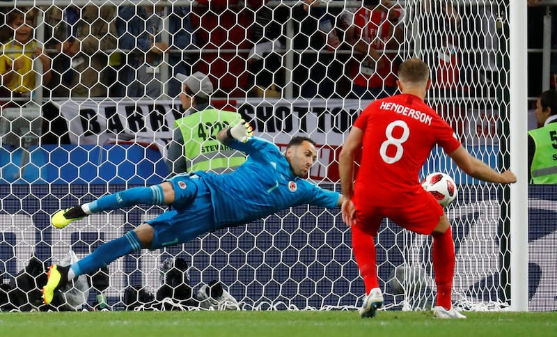 England's Jordan Henderson sees his penalty saved by Colombia's David Ospina - putting Colombia into a 3-2 lead in the shoot out. Kai Pfaffenbach / Reuters